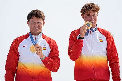 Gold medal winners Diego Botin Le Chever and Florian Trittel Paul during men's skiff medal ceremony